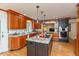 Gourmet kitchen with granite countertops, a central island, and stainless steel appliances at 8535 Washington Blvd, Indianapolis, IN 46240