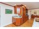 Custom kitchen with wood cabinets, granite counters, and modern appliances at 8535 Washington Blvd, Indianapolis, IN 46240