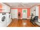 Well-equipped laundry room featuring ample storage, laundry, and exercise equipment at 8535 Washington Blvd, Indianapolis, IN 46240