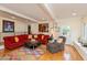Cozy living room with hardwood floors, colorful rug, and comfortable seating at 8535 Washington Blvd, Indianapolis, IN 46240