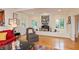 Bright living room with hardwood floors, fireplace, and comfortable furnishings at 8535 Washington Blvd, Indianapolis, IN 46240