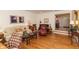Comfortable living room features hardwood floors, bay windows, and classic furnishings at 8535 Washington Blvd, Indianapolis, IN 46240