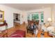 Elegant living room featuring hardwood floors, bay windows, and ornate décor at 8535 Washington Blvd, Indianapolis, IN 46240