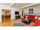 Bright living room with hardwood floors, colorful rug, and comfortable seating at 8535 Washington Blvd, Indianapolis, IN 46240