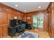 Cozy office space with custom wood paneling, built in desk, and large windows at 8535 Washington Blvd, Indianapolis, IN 46240