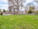Expansive backyard featuring a well-maintained lawn and privacy fencing at 8621 Manderley Dr, Indianapolis, IN 46240