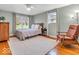 Cozy bedroom featuring a comfortable bed, hardwood floors, and soft lighting, creating a relaxing atmosphere at 8621 Manderley Dr, Indianapolis, IN 46240