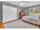 Comfortable bedroom with hardwood floors, a large closet, and natural light, offering a cozy retreat at 8621 Manderley Dr, Indianapolis, IN 46240