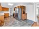 Spacious kitchen with stainless steel appliances, wood cabinets and a seamless transition into other areas at 8621 Manderley Dr, Indianapolis, IN 46240