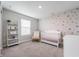 A bedroom with wallpaper, and a window at 8694 Moyer Pl, Pendleton, IN 46064