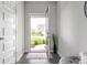 Inviting foyer with a view of the front yard through the open front door at 8694 Moyer Pl, Pendleton, IN 46064