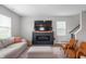 Cozy living room featuring a modern fireplace, comfortable seating, and stylish decor at 8694 Moyer Pl, Pendleton, IN 46064