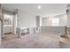 Neutral loft area with carpet, natural light, and storage at 8694 Moyer Pl, Pendleton, IN 46064