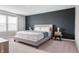This bedroom features a king bed, gray walls, and a gray accent wall at 8694 Moyer Pl, Pendleton, IN 46064