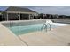 Community pool area is ready for water with a building with picnic tables nearby at 8694 Moyer Pl, Pendleton, IN 46064