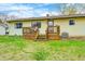 Sunny backyard featuring a deck, some trees, healthy grass, and good sunlight exposure at 9055 Panorama Ct, Indianapolis, IN 46234