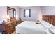 Comfortable bedroom with wood furniture, natural light from window, and soothing color palette at 9055 Panorama Ct, Indianapolis, IN 46234
