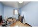 Functional blue bedroom featuring one window, wooden floors, and ample space at 9055 Panorama Ct, Indianapolis, IN 46234