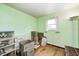 Simple green bedroom featuring a window, hardwood floors and ample space at 9055 Panorama Ct, Indianapolis, IN 46234