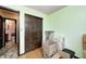 Spacious green bedroom with closet and connected bathroom with toilet and sink at 9055 Panorama Ct, Indianapolis, IN 46234