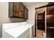 Well-lit laundry room with modern washer and dryer units, and lots of storage at 9055 Panorama Ct, Indianapolis, IN 46234
