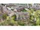 A high aerial view showcases the layout of a townhome community and its surrounding green space at 967 Orlando St, Carmel, IN 46032