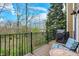 Relaxing balcony area with chairs, a table, and views of a verdant landscape at 967 Orlando St, Carmel, IN 46032