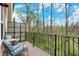 Outdoor balcony featuring comfortable seating, a small table, and scenic treetop views at 967 Orlando St, Carmel, IN 46032