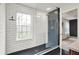 Contemporary bathroom featuring a glass-enclosed shower and modern fixtures at 967 Orlando St, Carmel, IN 46032