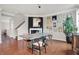 Modern dining room with hardwood floors, neutral colors, artistic decor, and ample light at 967 Orlando St, Carmel, IN 46032