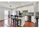 Charming kitchen with an island, stainless steel appliances, and an adjacent outdoor deck area at 967 Orlando St, Carmel, IN 46032