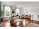 Spacious living area with hardwood floors, large windows, modern lighting and stylish furniture at 967 Orlando St, Carmel, IN 46032