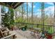 A cozy patio with wooden furniture and garden views, ideal for relaxation and enjoying the outdoors at 967 Orlando St, Carmel, IN 46032