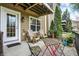 A charming patio with wood furniture, perfect for relaxing and enjoying the outdoor views at 967 Orlando St, Carmel, IN 46032