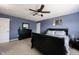 Inviting bedroom with a dark wood bed frame, matching dresser, and stylish decor, creating a serene atmosphere at 9770 Blue Violet Dr, Noblesville, IN 46060