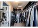 Walk in closet with multiple hanging rods, shelves and shoe storage at 9770 Blue Violet Dr, Noblesville, IN 46060