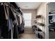 Walk in closet with lots of storage including metal racks and a view into the bedroom at 9770 Blue Violet Dr, Noblesville, IN 46060