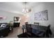 Cozy dining room area with stylish chandelier lighting and nearby staircase at 9770 Blue Violet Dr, Noblesville, IN 46060