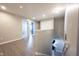 Well-lit hallway with hardwood floors, offering access to several rooms at 9770 Blue Violet Dr, Noblesville, IN 46060