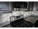 Granite countertops and stainless steel appliances highlight this modern kitchen at 9770 Blue Violet Dr, Noblesville, IN 46060