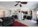 Open-concept living area flowing into dining and modern kitchen with granite countertops at 9770 Blue Violet Dr, Noblesville, IN 46060