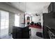 Bright open-concept layout with kitchen island connecting to living area at 9770 Blue Violet Dr, Noblesville, IN 46060