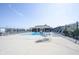 Community pool with several lounge chairs and tables at 9770 Blue Violet Dr, Noblesville, IN 46060