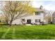 Expansive backyard featuring a large grassy area and a cozy patio perfect for outdoor entertaining at 9812 Logan Ln, Fishers, IN 46037