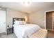 Bedroom featuring a decorative bench at the foot of the bed and modern decorations on the side tables at 9812 Logan Ln, Fishers, IN 46037