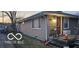 Charming single-story house with a welcoming porch, neutral siding, and a tidy front yard at 1006 Columbia Ave, Alexandria, IN 46001