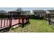 Spacious backyard featuring a wooden deck and gazebo, perfect for outdoor entertaining at 10597 Cyrus Dr, Indianapolis, IN 46231