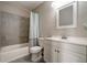 Clean bathroom with a white vanity, mirror, tub, and shower providing a refreshing and functional space at 10597 Cyrus Dr, Indianapolis, IN 46231