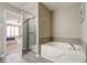 Bathroom featuring soaking tub and step-in shower at 10597 Cyrus Dr, Indianapolis, IN 46231