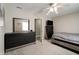 Well-lit bedroom featuring two large chests of drawers, carpet floors, and a ceiling fan at 10597 Cyrus Dr, Indianapolis, IN 46231